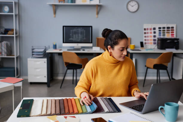 istock Designer of interior working on laptop 1490710103