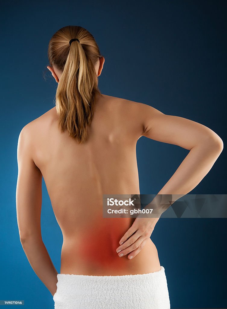 Woman massaging pain back Adult Stock Photo