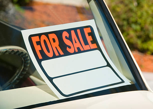 istock For sale sign sitting in car window 149071093