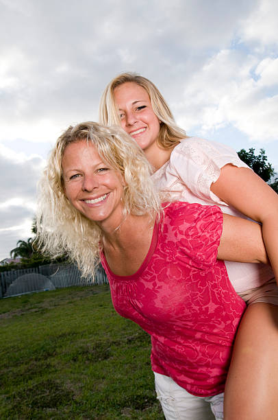 istock Teen Daughter on Mothers back 149071125