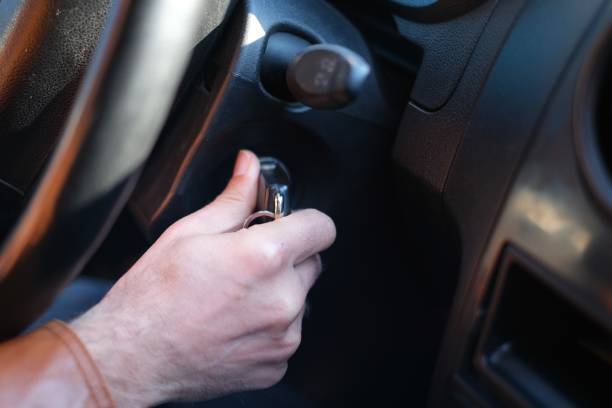 istock Hand's man plug in key, starting the engine of car 1490711502
