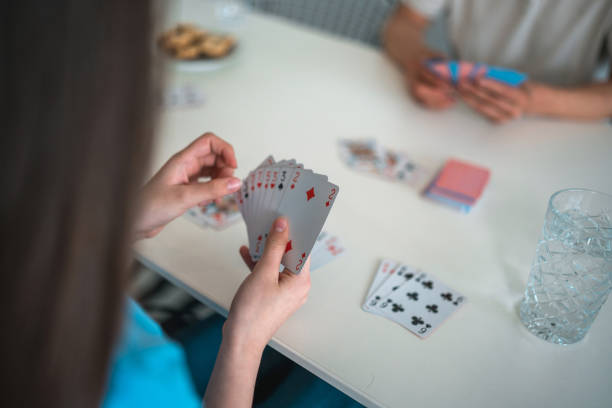 istock Unrecognizable Female Holding Playing Cards 1490711609
