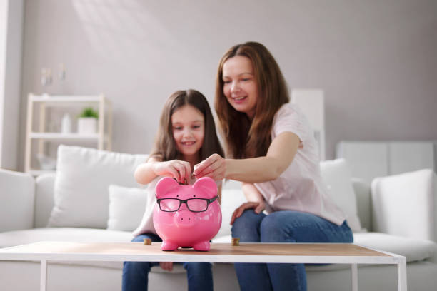 istock Mother And Child Saving Money 1490711670