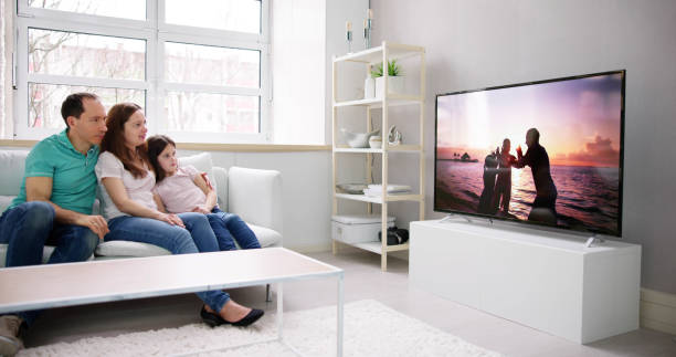 istock Young Family Watching TV Together 1490711815