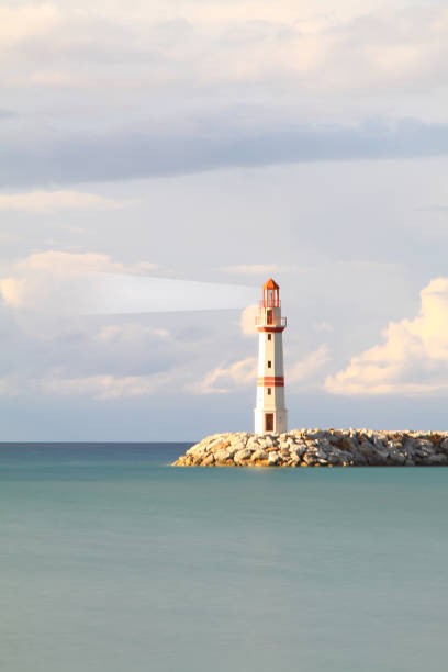 istock guiding and locator lighthouse with its light. very important for sea navigation. There is free space for writing. copy space. 1490712719