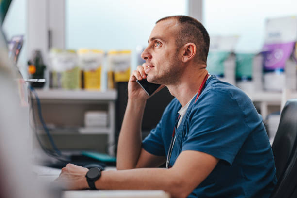 istock Smiling Vet Talking On A Mobile Phone In The Clinic 1490713573