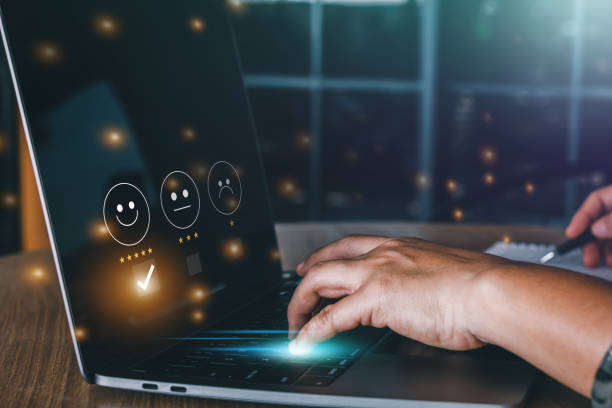 istock Satisfaction survey concept, business woman using laptop to answer questionnaire with five star icon 1490714232