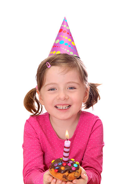 Little girl with birthday cake isolated on white background