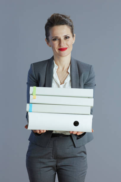 istock woman employee against gray background 1490716007