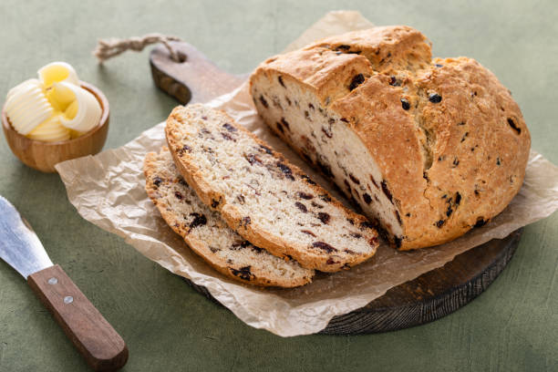 istock Soda bread in a cast iron pan with cranberries and pecans 1490718012