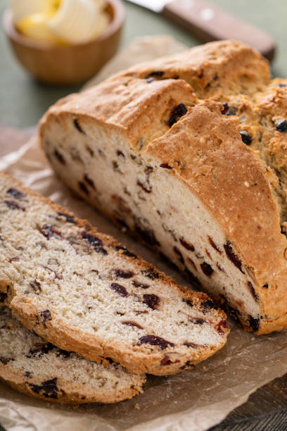 istock Soda bread in a cast iron pan with cranberries and pecans 1490718017