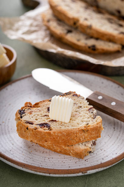 istock Soda bread in a cast iron pan with cranberries and pecans 1490718020