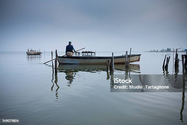 Fishing On Lesina Lagoon Stock Photo - Download Image Now - Saltwater Eel, Fisher - Role, Fishing Industry