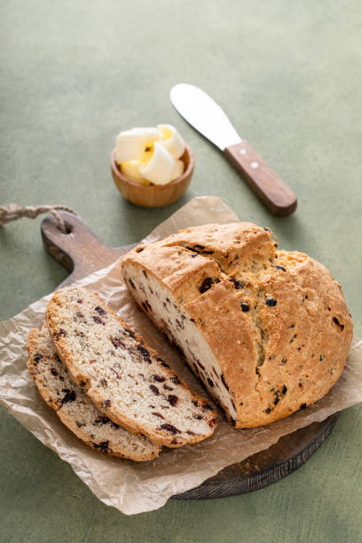 istock Soda bread in a cast iron pan with cranberries and pecans 1490718219
