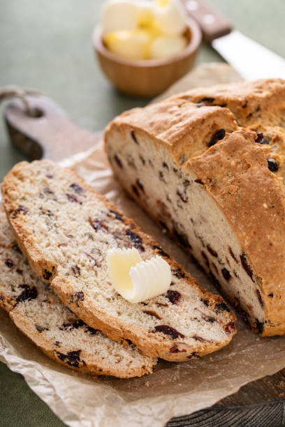 istock Soda bread in a cast iron pan with cranberries and pecans 1490718224