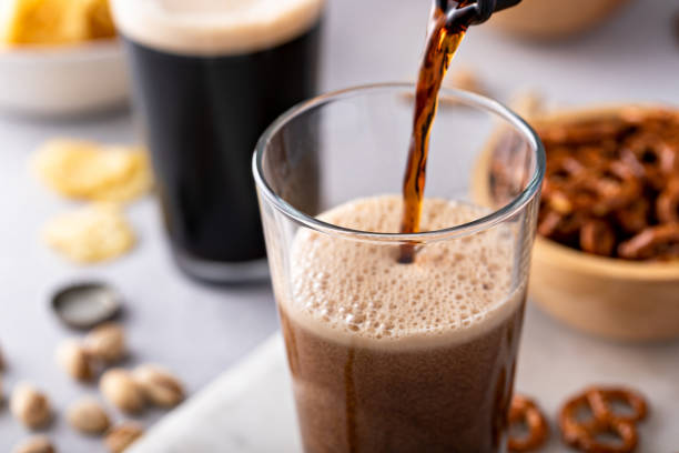 istock Pouring dark stout beer in a tall glass 1490718267