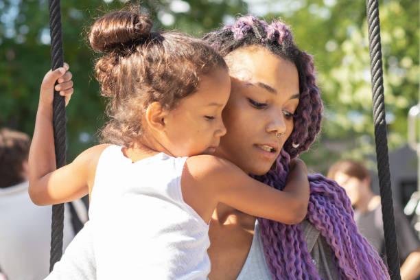 istock african mother hugging her daughter close up 1490718655