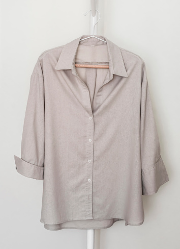 Cotton women's casual oversized  shirt on a hanger