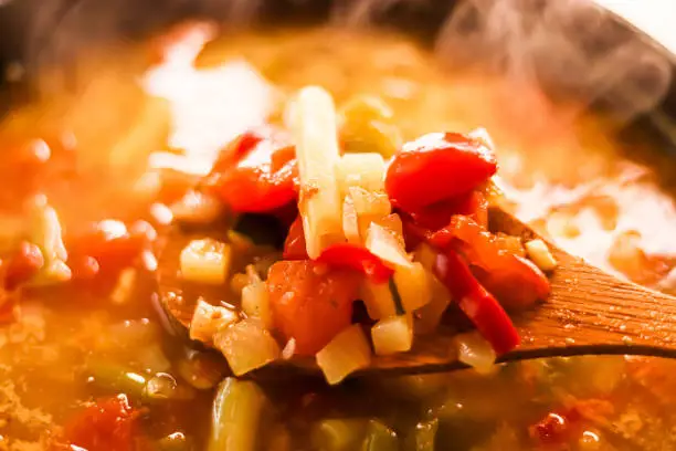 Cooking vegetable soup in saucepan, comfort food and homemade meal concept