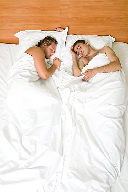 Gays sleeping stock photo