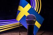 Microphone on a background of a blurry flag Sweden close-up