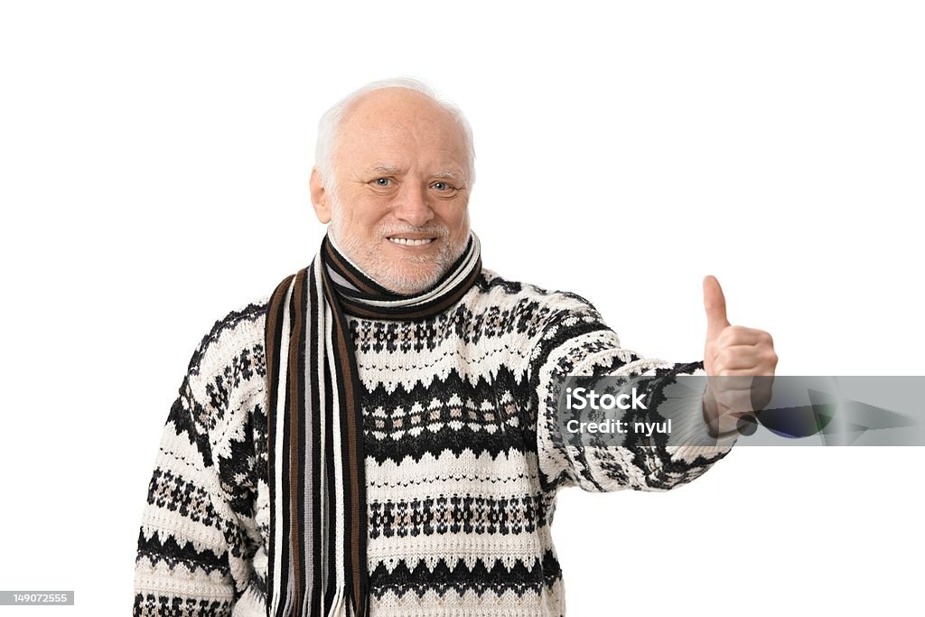 Portrait of happy senior man with thumb up Portrait of happy senior man looking at camera, showing thumb up, laughing, isolated on white. Men Stock Photo