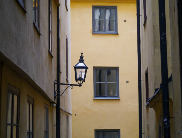 istock a wall lamp on the side of a building 1490726110