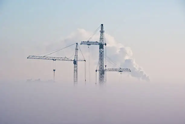 Photo of Cranes in clouds