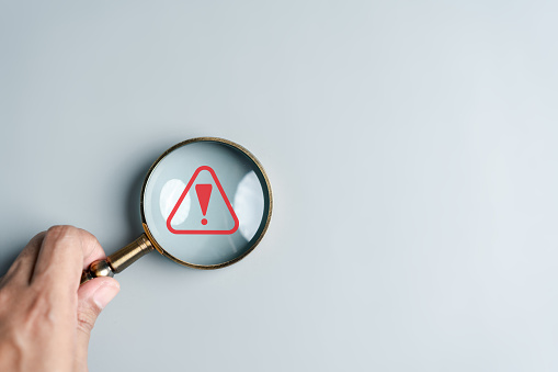 System Warning Caution Sign Inside Magnifier For Notification Error And ...