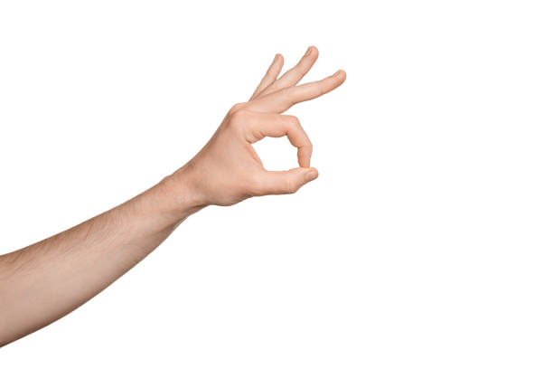istock Man's hand shows the OK sign to the camera, on a white background, isolate. 1490728821