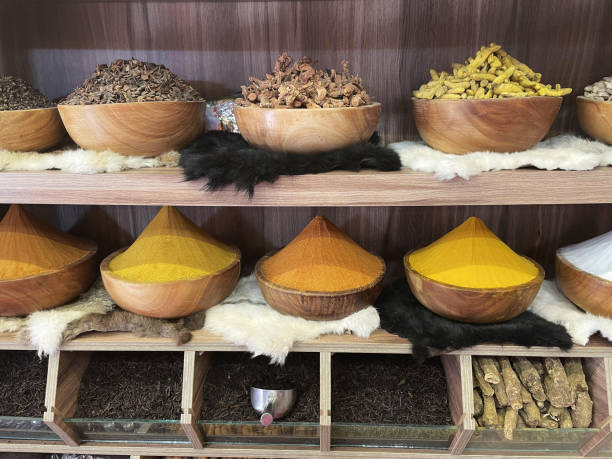 Different colorful spices on the shelves.
