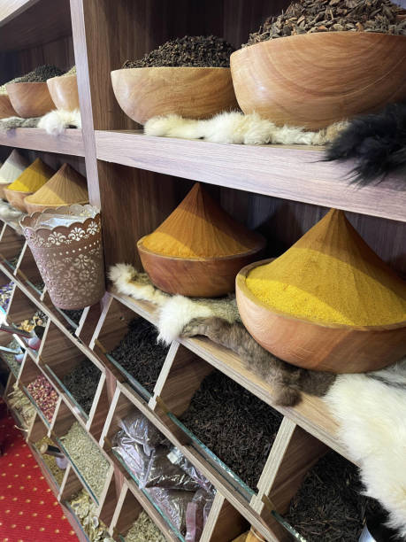 Different colorful spices on the shelves.