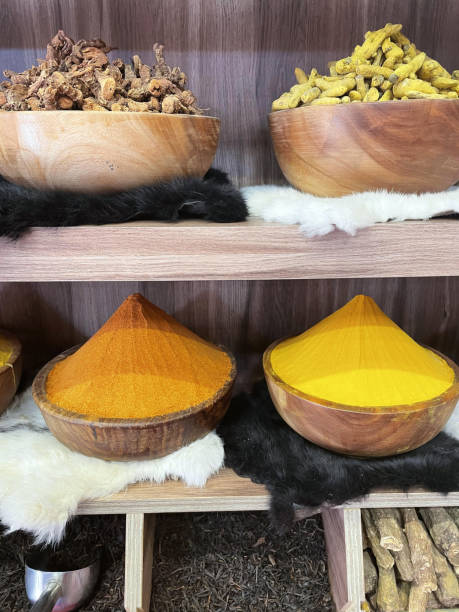 Different colorful spices on the shelves.