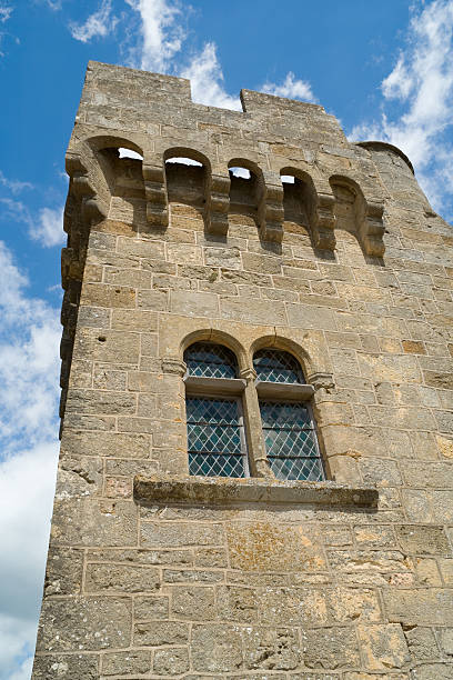 istock Castle tower with double lancet window in a blue sky 149073068