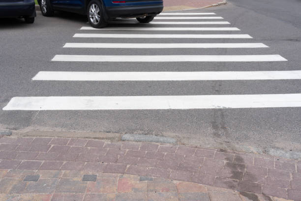 Parking violation, a car parked on a crosswalk.