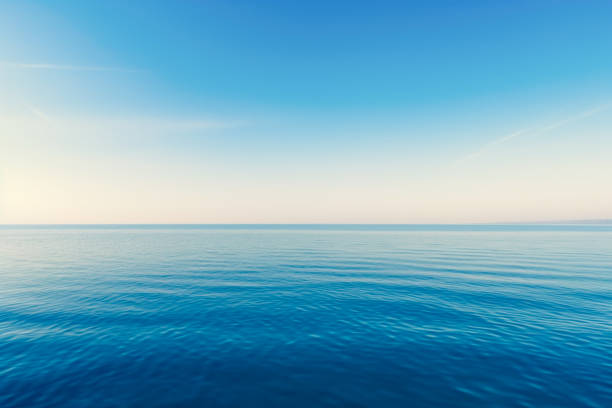 istock Blue sea with waves and sky with clouds.Calm tranquil blue sea relaxing background with copy space 1490735438