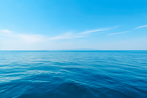 Blue sea ocean water surface and underwater with sunny and cloudy sky,seascape summer background wallpaper