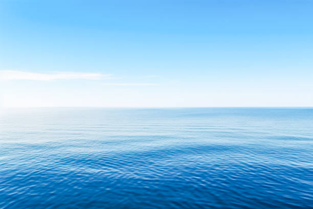 istock Blue sea with waves and sky with clouds.Calm tranquil blue sea relaxing background with copy space 1490736051