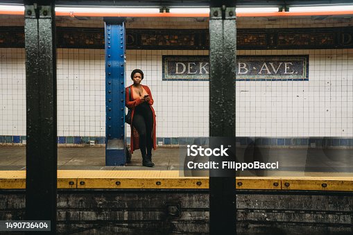 istock A woman is waiting for the train in Dekalb Ave station in Brooklyn 1490736404