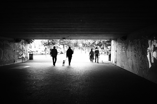 Legnano, Italy - May 15, 2023: some people go through an underpass