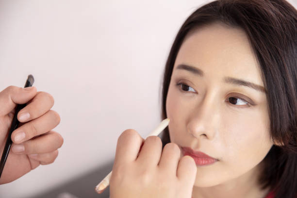 istock Young Asian woman live streaming to teaching make up online 1490741779
