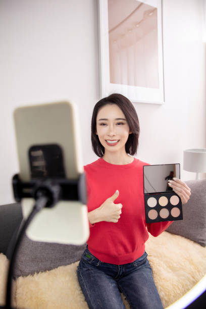 istock Young Asian woman live streaming to teaching make up online 1490748622