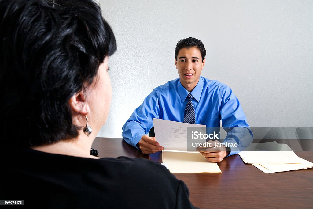 Job Interview Meeting A young businessman interviews a woman for a job. 2000-2009 Stock Photo