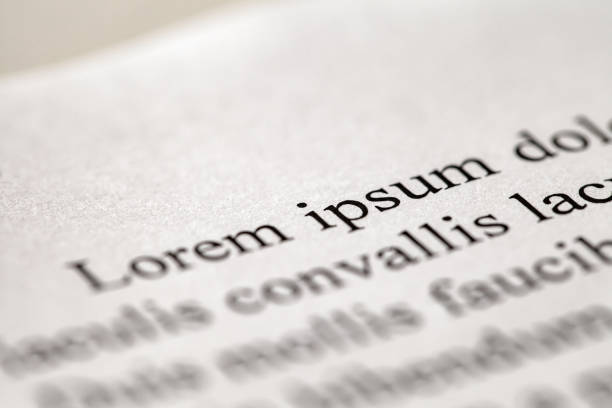 istock Inscription lorem ipsum template is printed in black on white paper close-up, selective focus 1490754310