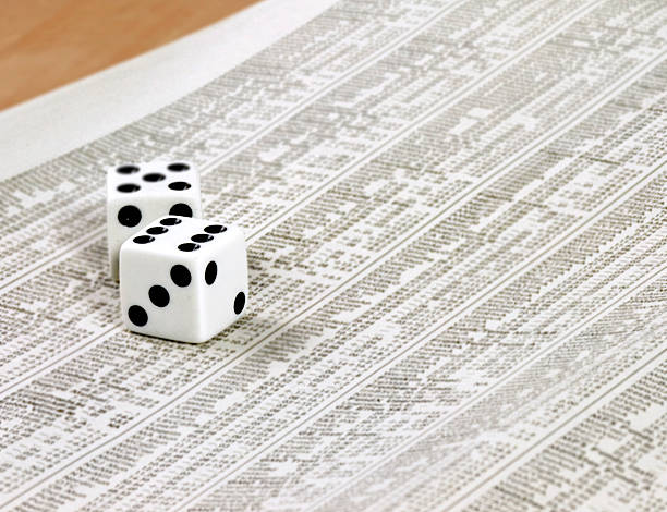 Dice on newspaper stock photo