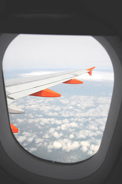 istock Airplane wing with fuel tanks  above the clouds 149075501