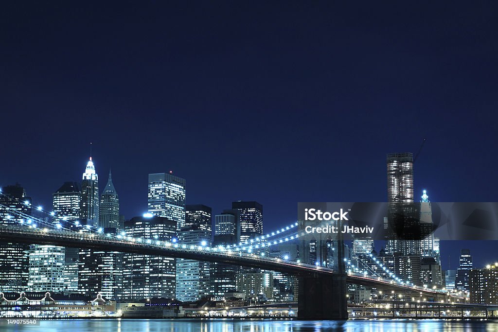 Brooklyn Bridge and Manhattan Skyline At Night Brooklyn Bridge and Manhattan Skyline At Night, New York City Apartment Stock Photo