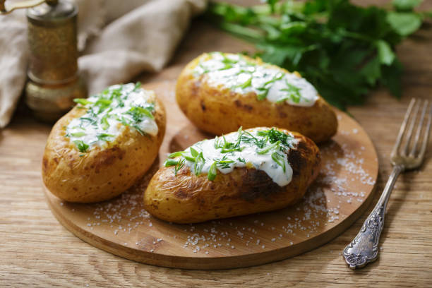 istock Baked potato with cream sauce 1490755592