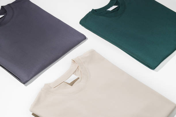 istock Plain t-shirts assorted colors with blank label. T-shirts isolated on a white background. Space for logo. Mockup 1490755915