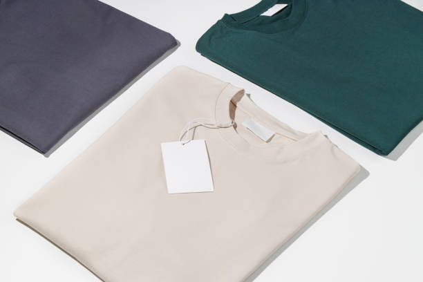 istock Plain t-shirts assorted colors with blank label. T-shirts isolated on a white background. Space for logo. Mockup 1490755937
